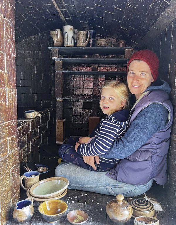 4 Maya Machin and her daughter unloading a kiln.