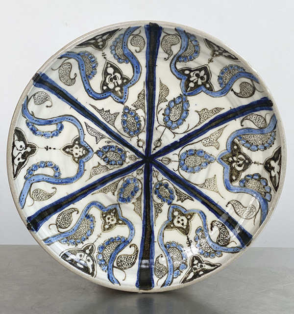 15 Geometric Pie Shape Plate, 10 in. in diameter, ceramic, fired to cone 10 in an electric kiln. Photo: Asa Mader. Inspired by a 13th-century Kashan bowl, Iran, from the Harvey Plotnick Collection.