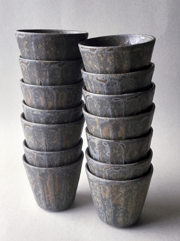 1 Rusty blue-gray faceted cups, to 8½ in. (22 cm) in diameter, grogged red stoneware, blue-gray underglaze, ash glaze, 2022.