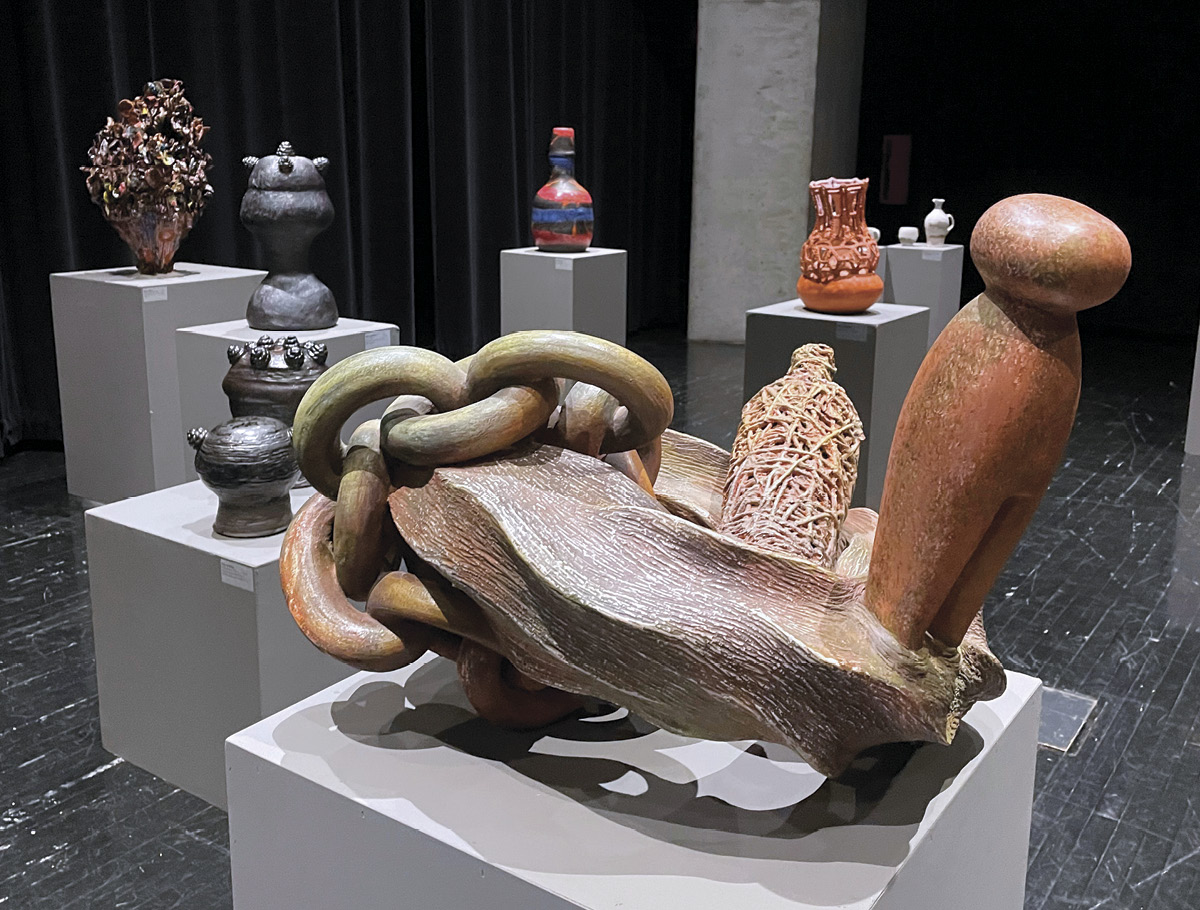 1 Foreground: Syd Carpenter’s Mother Pin Awash, 28 in. (71 cm) in length, clay, watercolor, 2016. Installation view of “Clay Holds Water, Water Holds Memory,” at the Contemporary Arts Center in Cincinnati, Ohio.