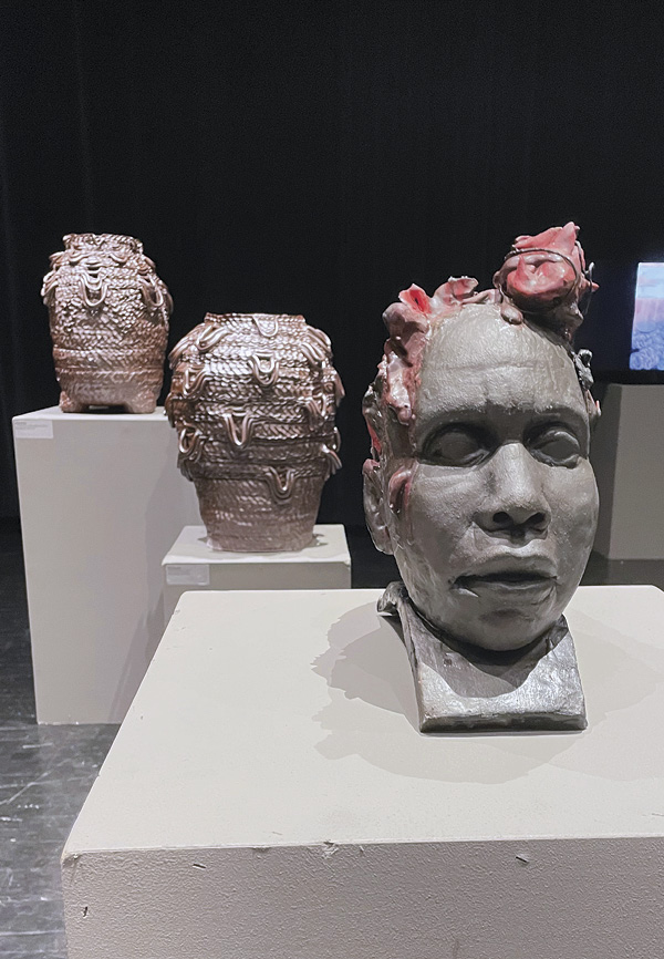 4 Foreground: Victoria Walton’s Finding A Way Forward, 13 in. (33 cm) in height, glazed stoneware, resin, 2022.