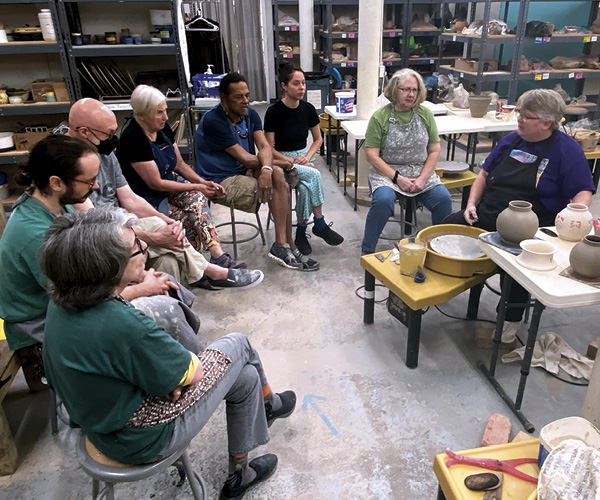 6 Julia Mann leading a class demonstration at The Village Potters Clay Center.