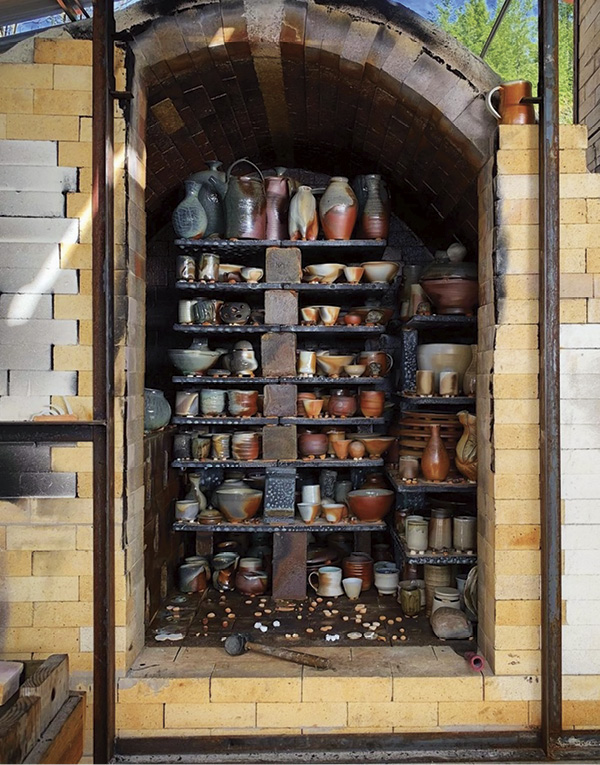 7 Pots stacked in a wood-fired catenary-arch kiln, 2021. Photo: Joe Robinson.