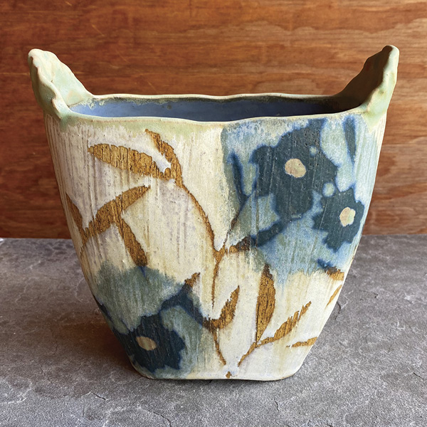 4 Colleen Riley’s oval vase, 8 in. (20.3 cm) in height, light stoneware, layers of iron wash, teal matte glaze, wax resist, SC Creamy, fired in a neutral atmosphere to cone 10, 2023.