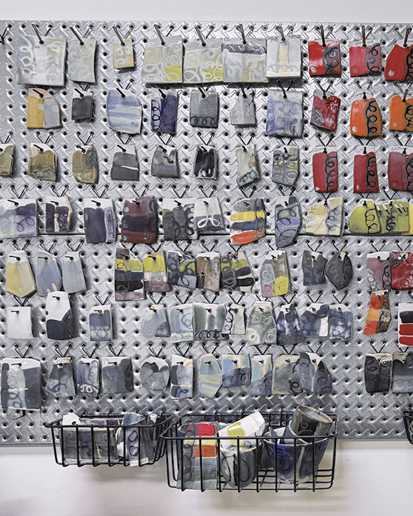 Wall of glaze samples in the stuido of Donovan Palmquist and Colleen Riley.