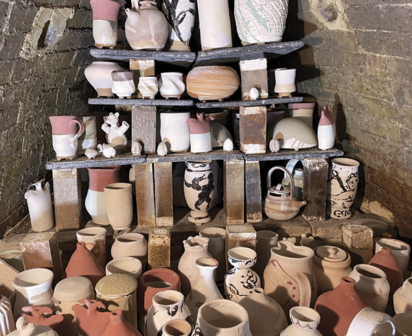 4 A collection of pots being loaded into the Hambidge Center’s kiln in Rabun Gap, Georgia.