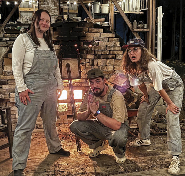 1 Sadie Misiuk, Brett Sauve, and Persis Wade on shift during the final firing of the kiln in April 2024. Photo: Justin Rothshank.