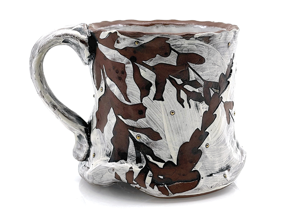 2 Sam Oliver’s Foliage Mug, 4¾ in. (12 cm) in width, handbuilt earthenware, stencil resist, slip, underglaze, borax wash, fired to cone 1 in an electric kiln, luster accents, 2023.