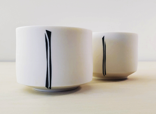 3 Double Linked Cups, 3⅓ in. (8 cm) in width, porcelain, oxide wash.