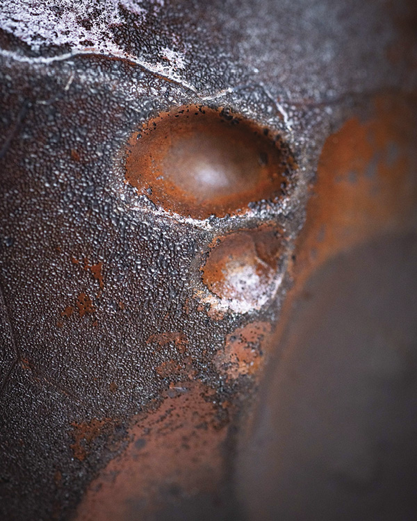 1 Alex Olson’s wood-fired bowl (detail), 5 in. (12.7 cm) in width, wheel-thrown and altered iron-rich stoneware, Red Art Flashing Slip, wood-fired to cone 9/10, reduction-cooled.