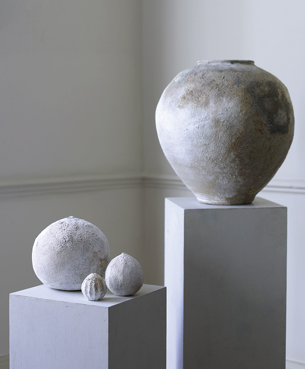 2 Akiko Hirai’s Poppy Seed Vessels, varying heights, and Suzu Tsubo, 16 15/16 in. (43 cm) in height, stoneware, porcelain slip.