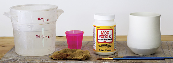 1 Prepare a bucket of water, small container, sponge, Mod Podge, paintbrush, and bone-dry greenware.