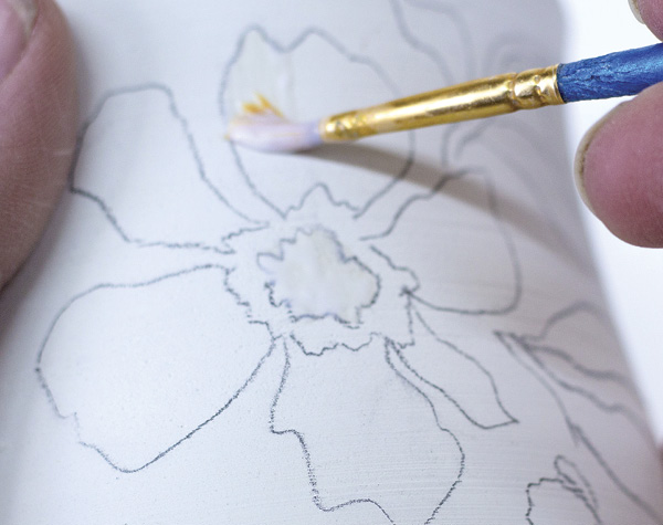 2 Apply an even coat of diluted Mod Podge with a brush.
