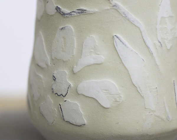 4 Etched design on greenware cup.