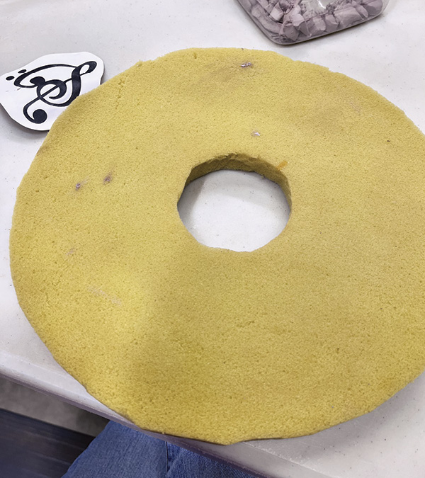 4 Cut a hole in a piece of upholstery foam.