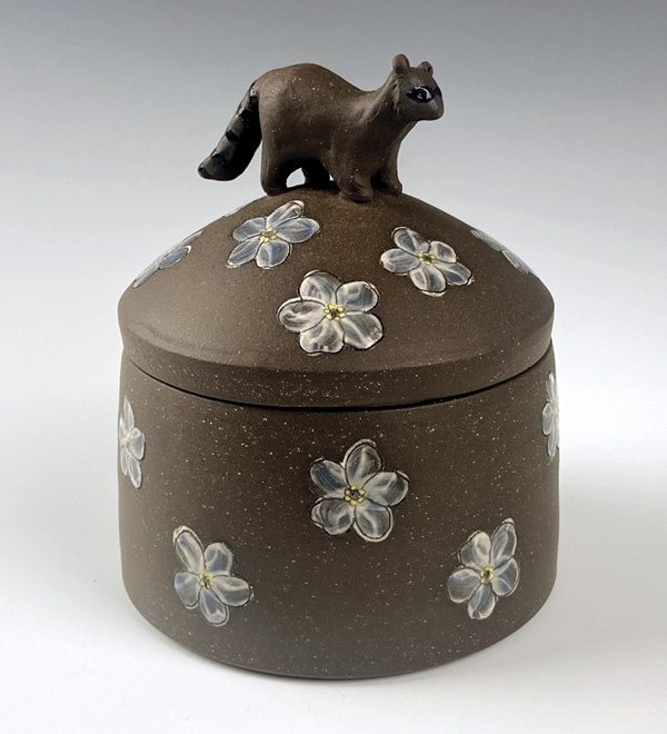 1 Britta Schroeder’s Raccoon Jar, 4½ in. (11 cm) in height, wheel-thrown and sculpted stoneware, slip, underglaze, fired to cone 5 in oxidation, 2023.