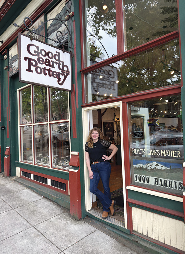 1 Good Earth Pottery owner AnnMarie Cooper in the door of the gallery, 2025. Photo: Kit Cooper.