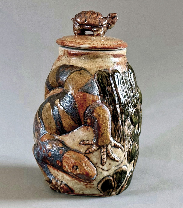 1 Janet K. Burner’s Tucson Lifestyle, 9½ in. (24.1 cm) in height, sculpted and carved stoneware, repoussé, underglazes, black wax, fired in reduction to cone 10, 2025.