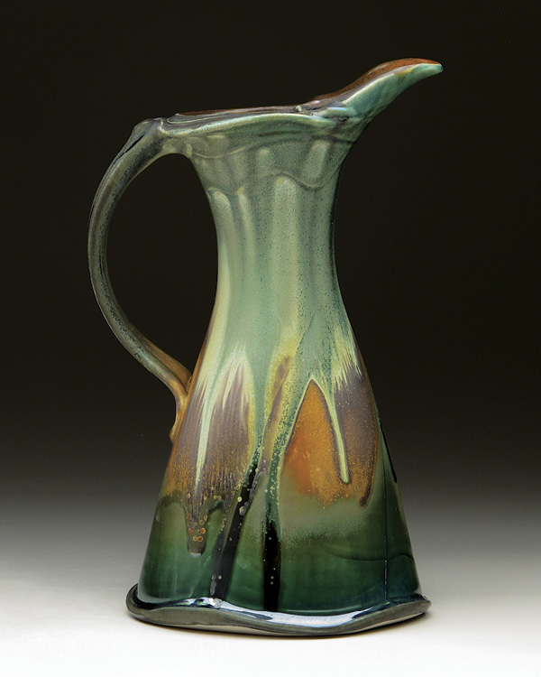 Steven Hill’s Cypress Pitcher, 12 in. (30 cm) in height, thrown-and-altered porcelain, pulled handle, multiple sprayed-and-layered glazes, fired to cone 8 in an electric kiln, 2020.