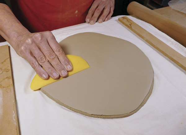 1 Roll out a slab to about 0.4 in. (1 cm) thick and smooth the surface.