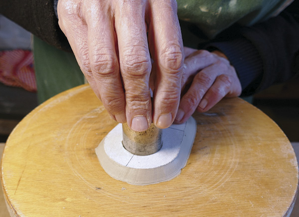 12 Use a hole cutter to cut out the opening from the top piece.