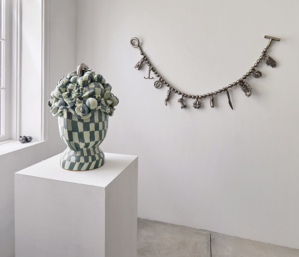 10 Juicy Fruit Jar, 24 in. (61 cm) in height, earthenware, slip, glaze, luster, 2023; Charming, 5 ft. 8 in. (1.7 m) in width, earthenware, glaze, luster, steel cord, hardware, 2023. Photo: Copyright Alan Wiener, courtesy Greenwich House Pottery.
