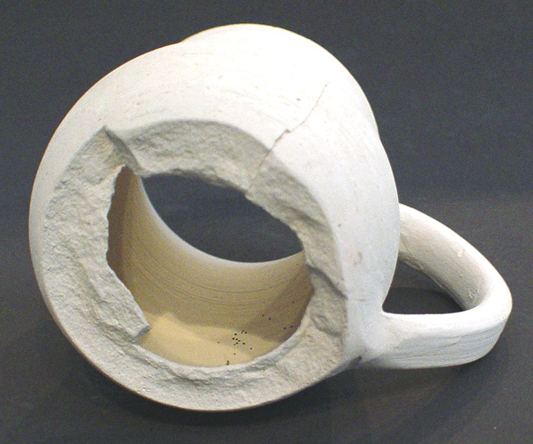 1 The result of explosive release of water as steam in the bisque firing.