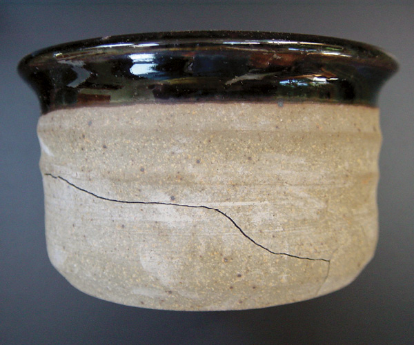 2 Sharp-edge cooling crack in the glaze firing resulting in stress between the clay body and the glaze.