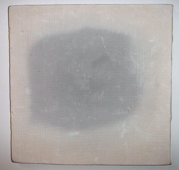 3 Carbon trapping in a bisque-fired tile. Organic material has not been fully released from the clay body.