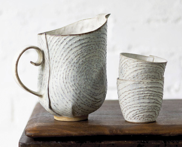 Clare Unger's Jug and cups, to 6 in. (16 cm) in height, Keanes 33 mid-range clay, cobalt and manganese oxides, mid-range satin matte glaze, 2025.