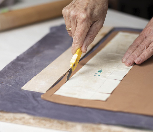 1 Roll out a thin slab and cut out the cup piece using a pattern.