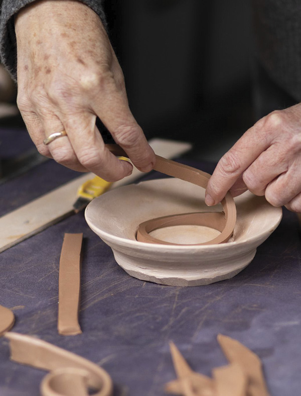 10 Form the foot ring using a bisque mold.
