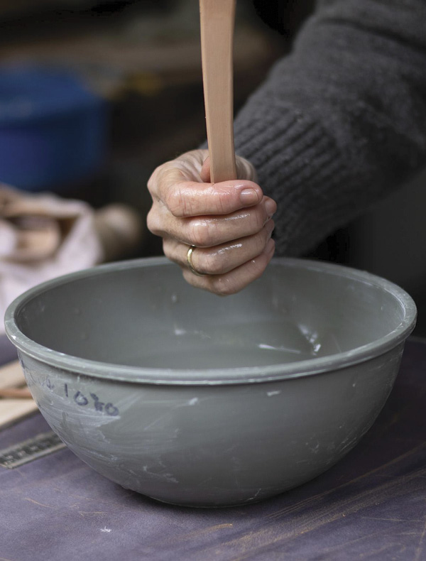 12 Gently pull the handle, softening the edges and beginning to create the curve.