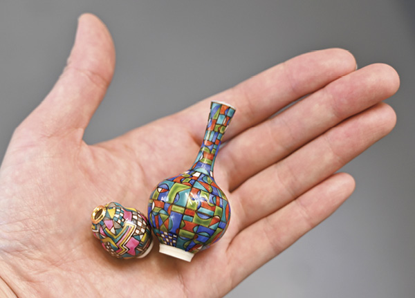 1 Miyu Kurihara and Yuta Segawa’s painted pots, to 2⅜ in. (6 cm) in height, glazed porcelain, 2022. Photo: Miyu Kurihara.