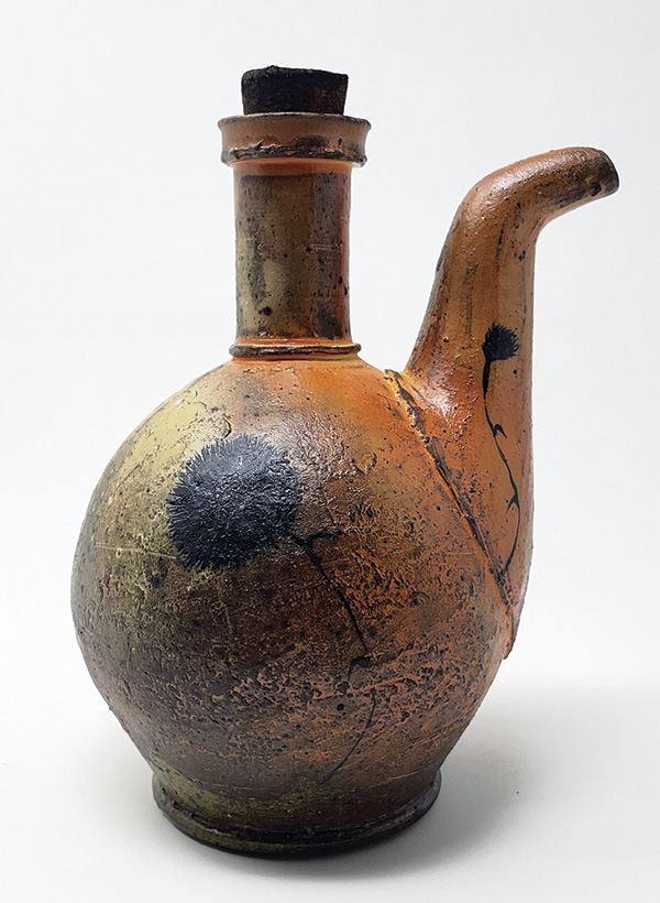 8 Ashton Keen’s ewer, 5½ in. (14 cm) in height, cone-3 red earthenware, XX Sagger terra sigillata, underglaze, soda fired, cork and bronze finish, 2023.