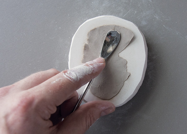 6 Gently release the sprig from the mold with a palette knife, spatula or lump of clay.