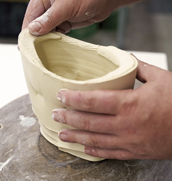 8 Blend the coils to the scored rim. Allow them to firm up.