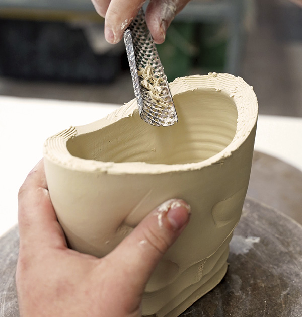 9 Once the coils are set up, use a rasp to clean up the lines, giving the rim of the basket an inward angle and a thick-to-thin quality.