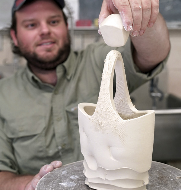 14 Check the scale of the finial in relation to the basket. Using various rasps and serrated ribs, sculpt the handle down to the desired shape.