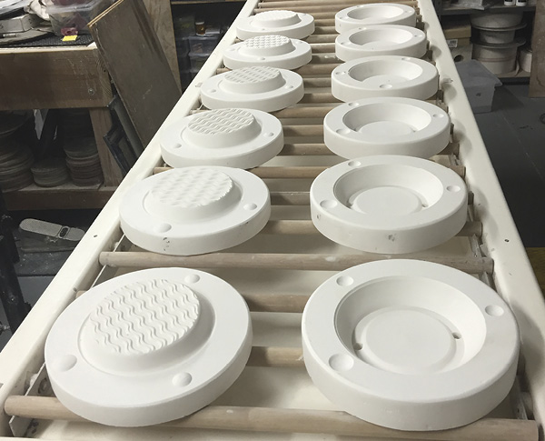 3 Two-part molds for casting a small, textured plate.