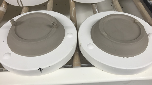 5 Back of the plate, ready to cut off slip plugs.
