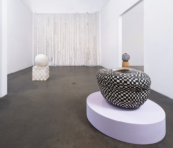 7 Front to back: Brittany Mojo's Nowness, 20 in. (50.8) in width, stoneware, underglaze, once fired to mid range in a gas kiln; May be a platonic thing, 34.5 in. (87.6 cm) in height, porcelain appliqué on stoneware, once fired to cone 6 in an electric kiln; Wallpaper Series, dimensions variable, porcelain, once fired in reduction to cone 10 in a gas kiln, glass, sterling silver, silver, brass, stainless steel, mixed media. Part of Mojo’s solo exhibition, Nowness, 2021. Photo: Mason Kuehler.
