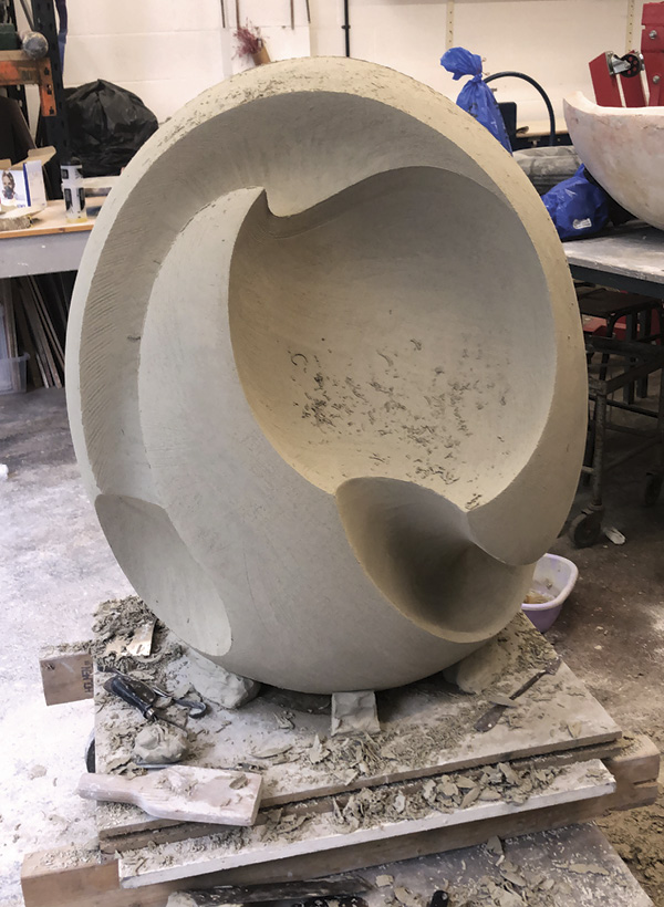 8 James Oughtibridge's Alluvion in construction, shown with the final slabs being inserted, completed in the greenware stage, and safely loaded into the kiln ready to be fired. Alluvion, once fired, was molded and cast in bronze for Hugo Burge.