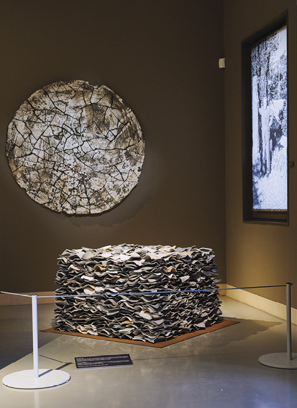 2 Pekka Paikkari’s Over the roofs, 39 in. (99 cm) in width, whitish grogged stoneware clay.