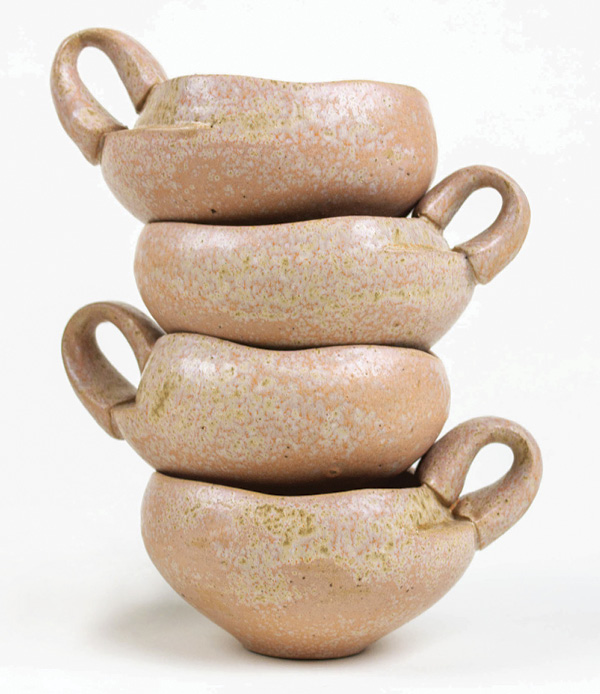 1 Amy Sanders’ cappuccino mugs, 5 in. (12.7 cm) in height, Sanders Mid-Range Orange Stoneware, Val Cushing’s D Base Matte (Modified) with 4% orange Mason stain, fired in oxidation to cone 6, 2025.