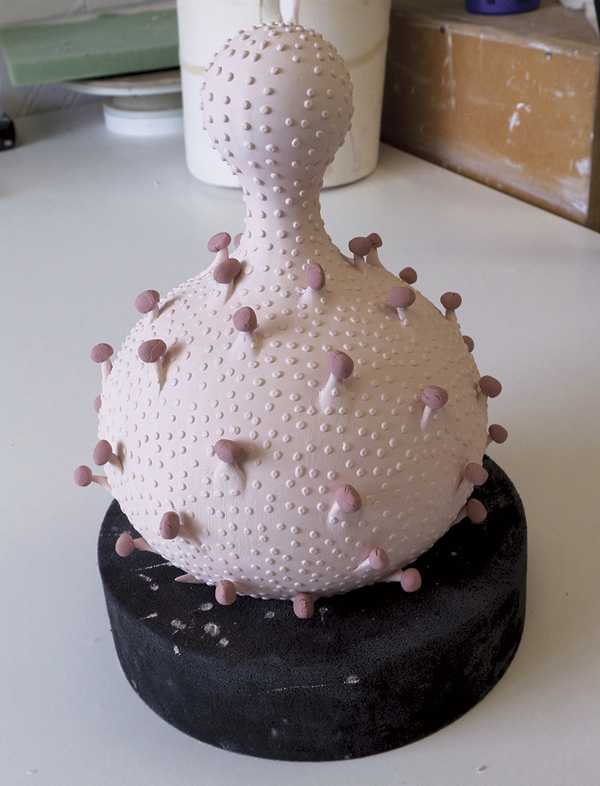 4 View of the vessel right before the glaze firing, showing the gloop glaze perched on each spike.