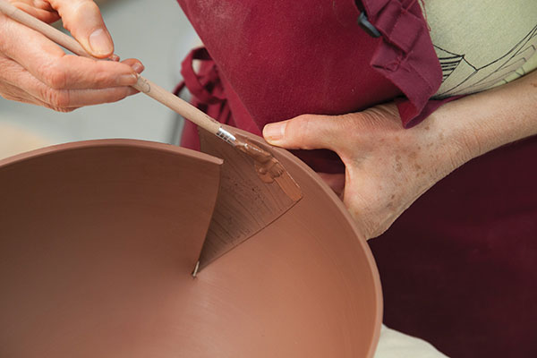 12 Gradually overlap the clay cuts, score and slip within the over-lapped area and join.