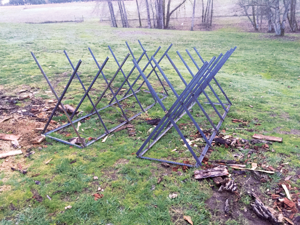 1 Metal X-frame racks allow wood to be quickly loaded on and cut to manageable lengths.