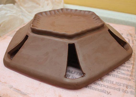 8 After removing the bowl from the mold you can alter the shape by cutting out sections freehand or adding a coil foot.