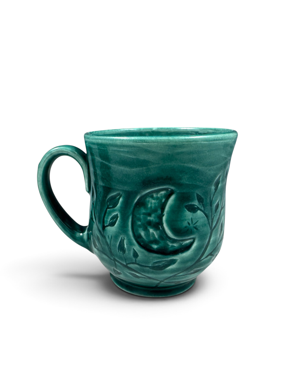 Turquoise mug with moon and floral decoration by Ann Marie Cooper